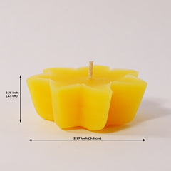 Yellow candle with dimensions indicated on a white background