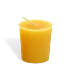 Yellow candle with wick on a white background