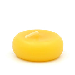 Yellow Beeswax Floating candle on a white background
