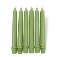 Set of green candles on a white background