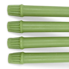Beeswax green candles with wicks on a white background