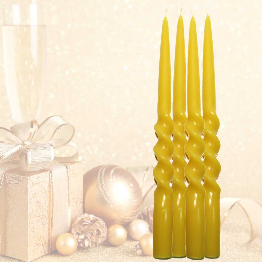 Set of four twisted beeswax candles with a decorative background featuring a gift and ornaments.