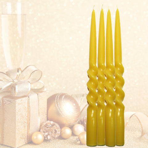 Set of four twisted beeswax candles with a decorative background featuring a gift and ornaments.