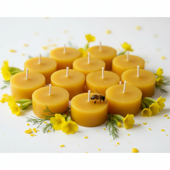 candles on a white background with small yellow flowers, a honeybee, wax crumbs